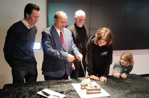 The Mayor and winners of the Short Film Competition cutting the birthday cake