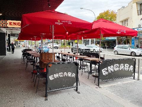 Tables and chairs outdoors at Encasa Restaurant on Longueville Road