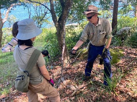 Supervisor teaching volunteers on site